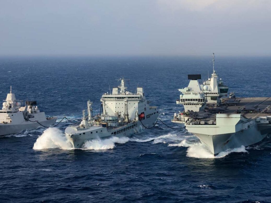 HMS Queen Elizabeth conducts a RAS whilst launching Jets